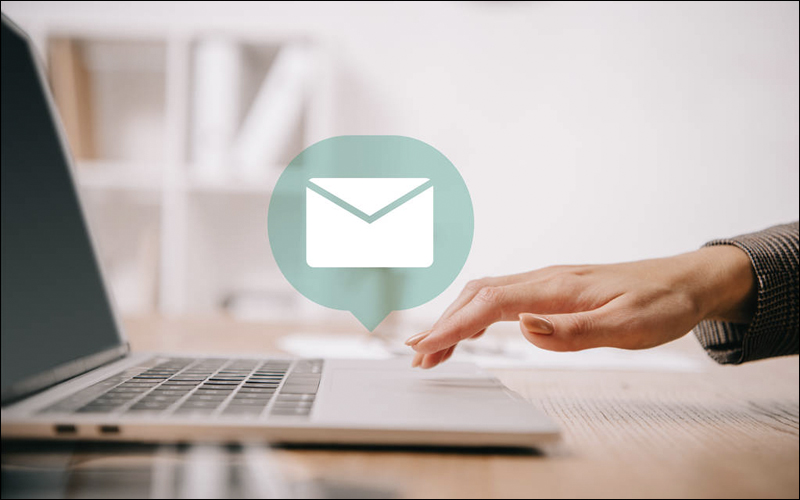 Person using laptop for email.