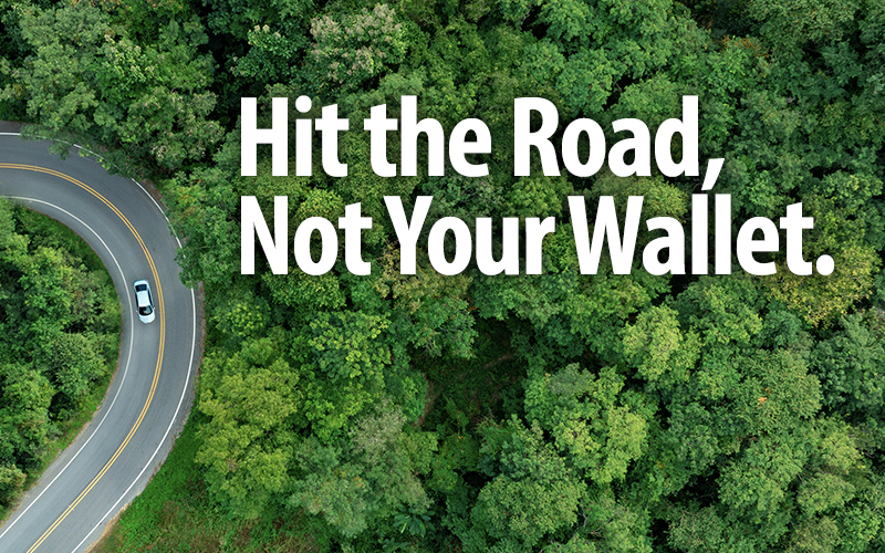 Hit the Road, Not Your Wallet. Photo from above of car driving on road.