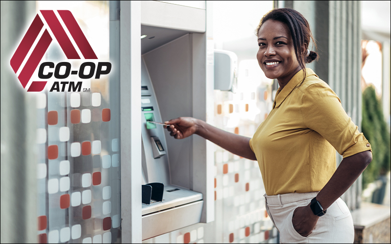 CO-OP ATM Logo over a photo of a woman using an ATM.