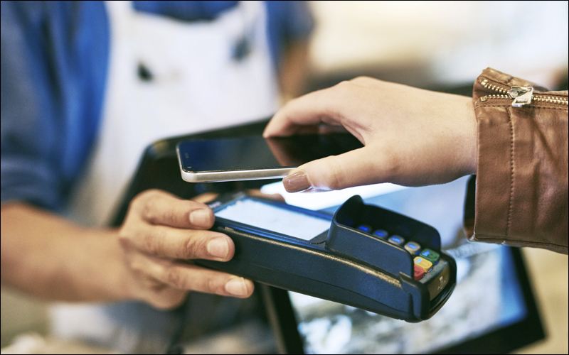 Person using tap-to-pay.