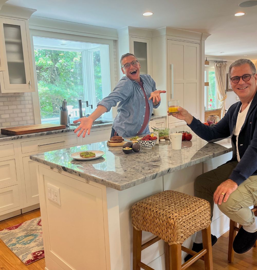 Men sitting in kitchen