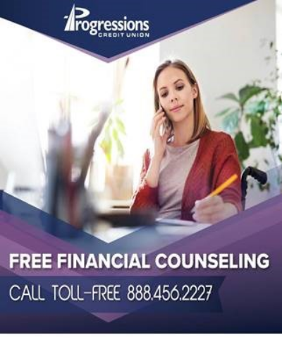 woman sitting at desk talking on a phone