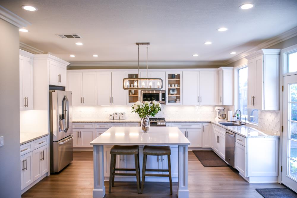 Kitchen with white cabinets and center island