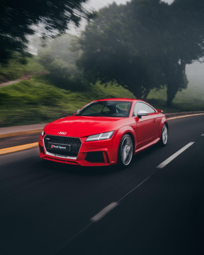 red Audi coupe on a road
