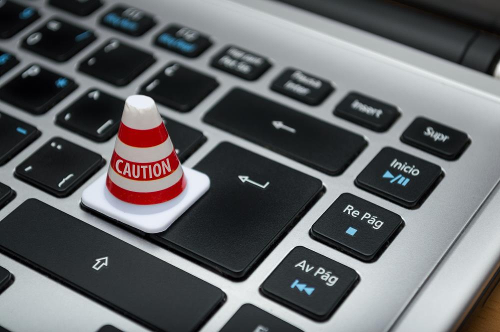 mini caution cone sitting on a keyboard